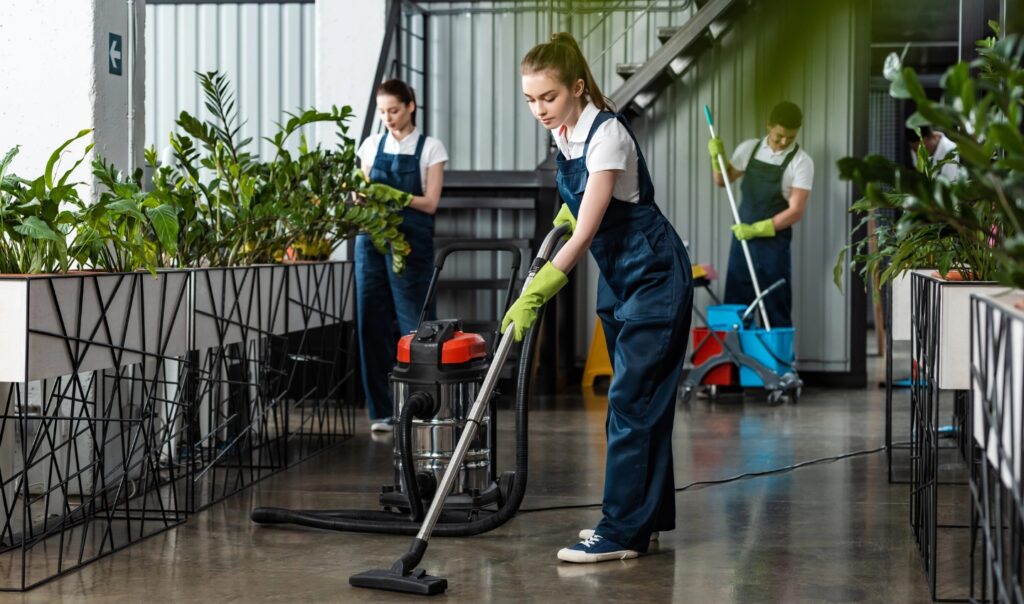 group of cleaners cleaning the plants nursery