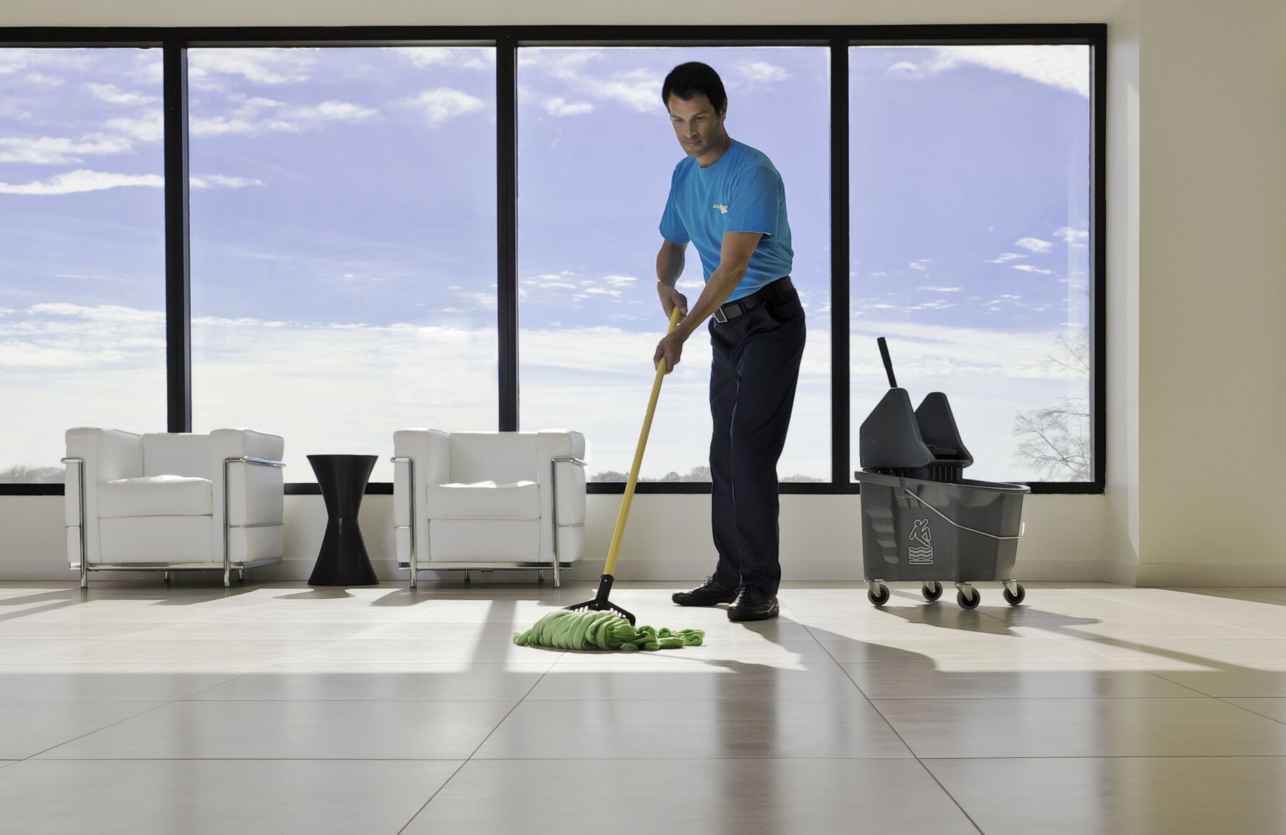 Man mopping the floor