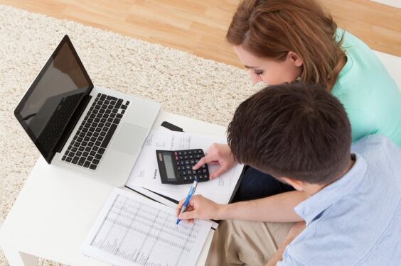A man and woman calculating finance
