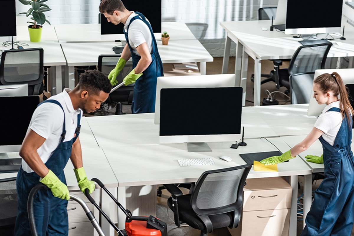 group cleaning the office area