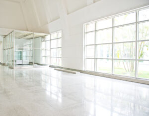 23534258 - empty long corridor in the modern office building.