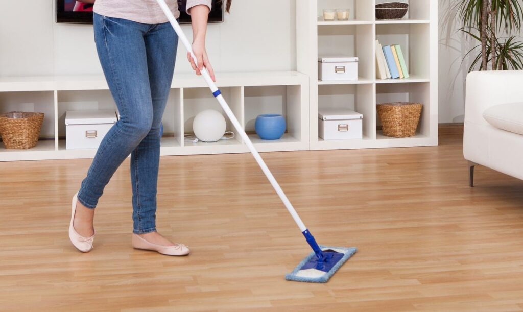 Preparing hardwood floor surface for disinfection, relevant to step-by-step guide.