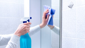 wiping a mirror