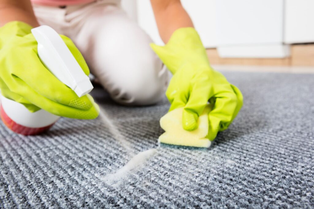 Image of stained commercial carpet, relevant to disinfection guide for business owners.