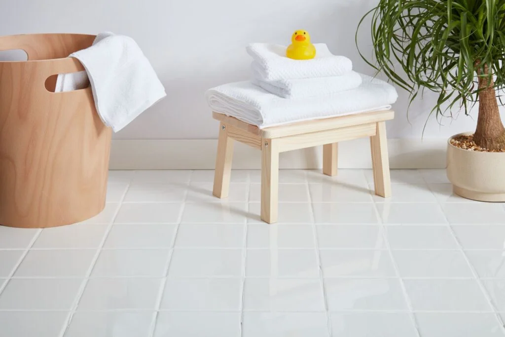 A clean ceramic tile bathroom floor, relevant to step-by-step commercial tile floor cleaning guide