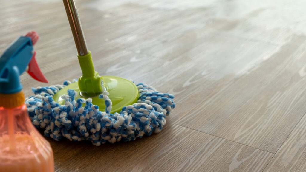 Efficient cleaning team working on linoleum floors, ensuring a spotless and well-maintained space with expert care