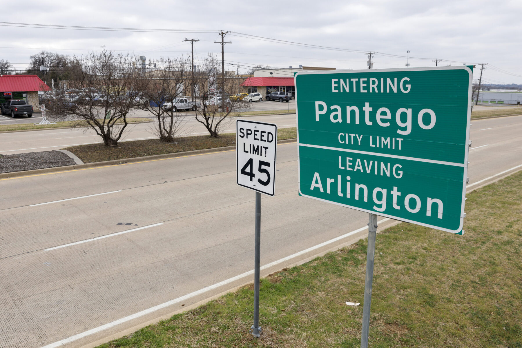 A sign shows the city limits along Pioneer Parkway of Arlington and Pantego, Texas, Wednesday, Jan. 25, 2023.