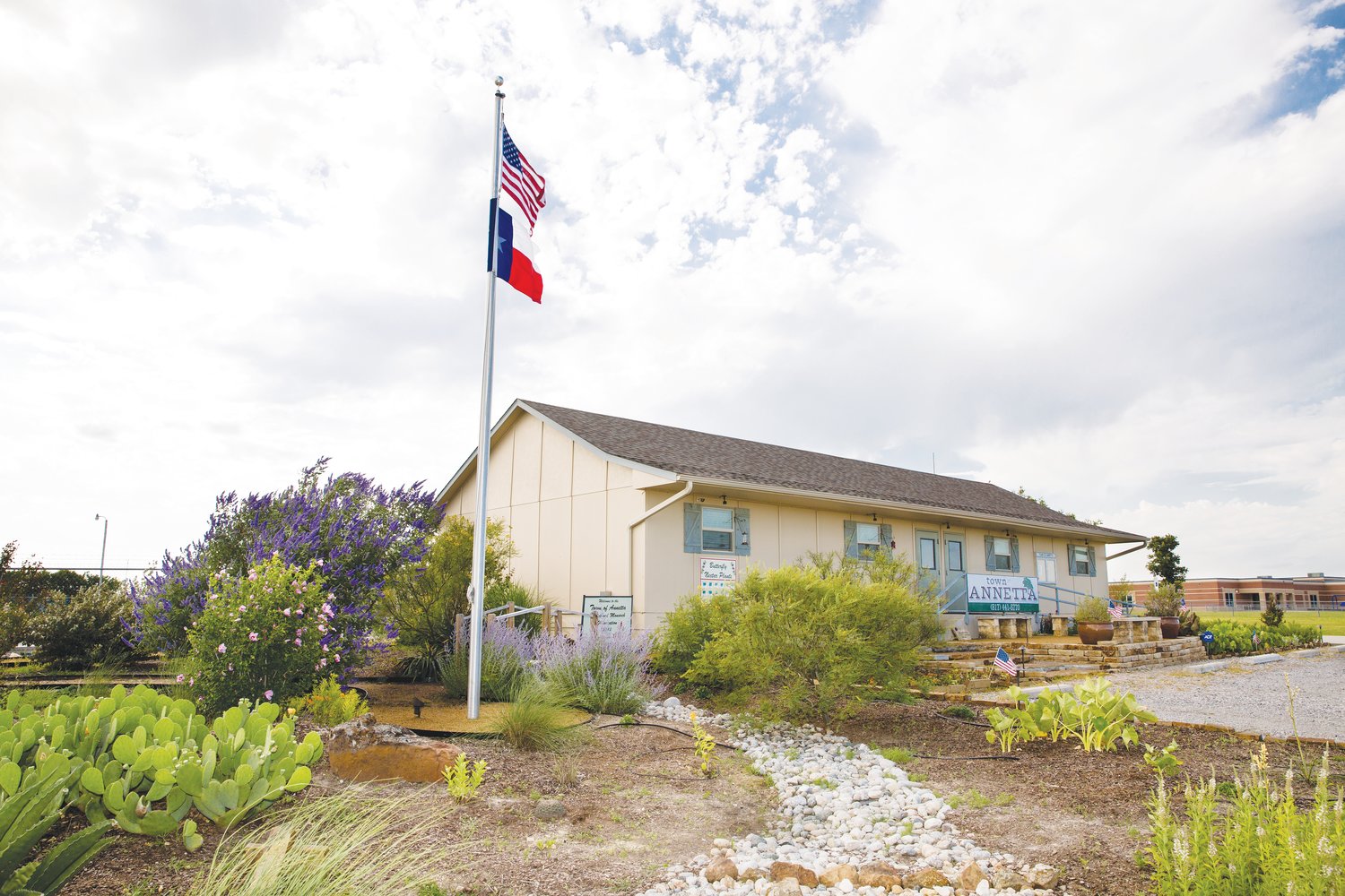 City Hall in the town of  Annetta. The butterfly garden is a registered Monarch Waystation.