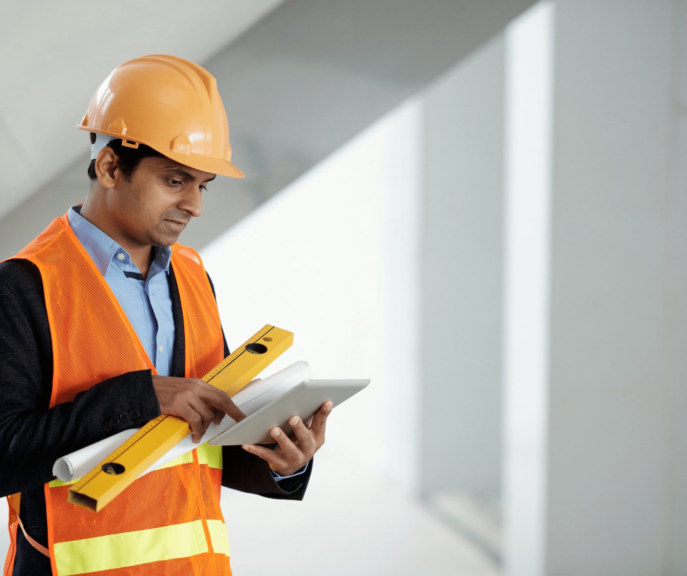 a construction engineer searching on his tablet about dallas janitorial services