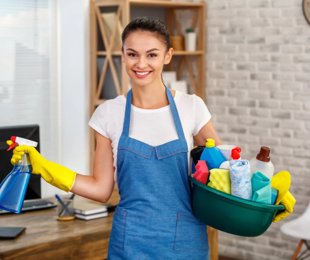 lady carrying cleaning supplies