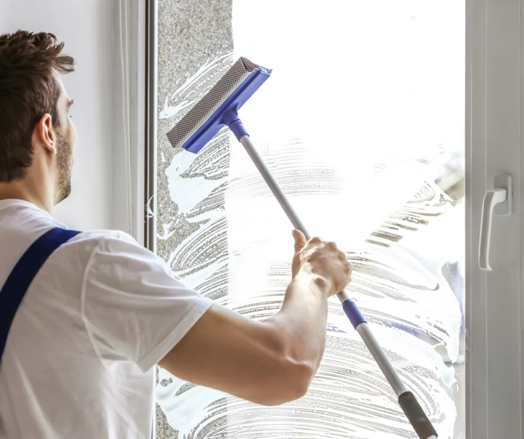 A man cleaning window