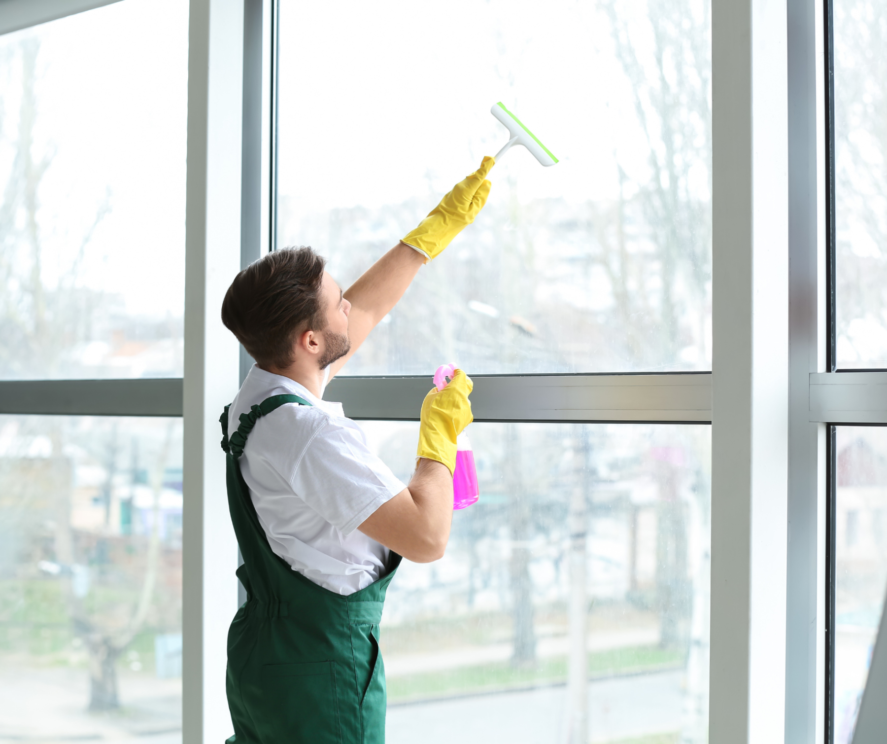 A man cleaning the window