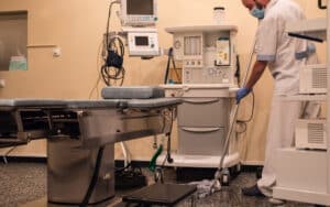 cleaning staff cleaning and sterilizing the operating room after surgery