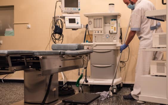 cleaning staff cleaning and sterilizing the operating room after surgery