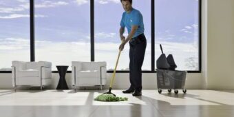 Man mopping the floor