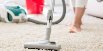 Suction grey carpet cleaning with vacuum cleaner