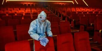 movie theater cleaning Movie Theater Cleaning Professional in Dallas Wiping Theater Chairs After A Showing