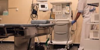 cleaning staff cleaning and sterilizing the operating room after surgery